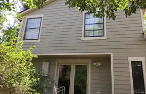 Centennial Home with Woodpecker-Damaged Wood Siding